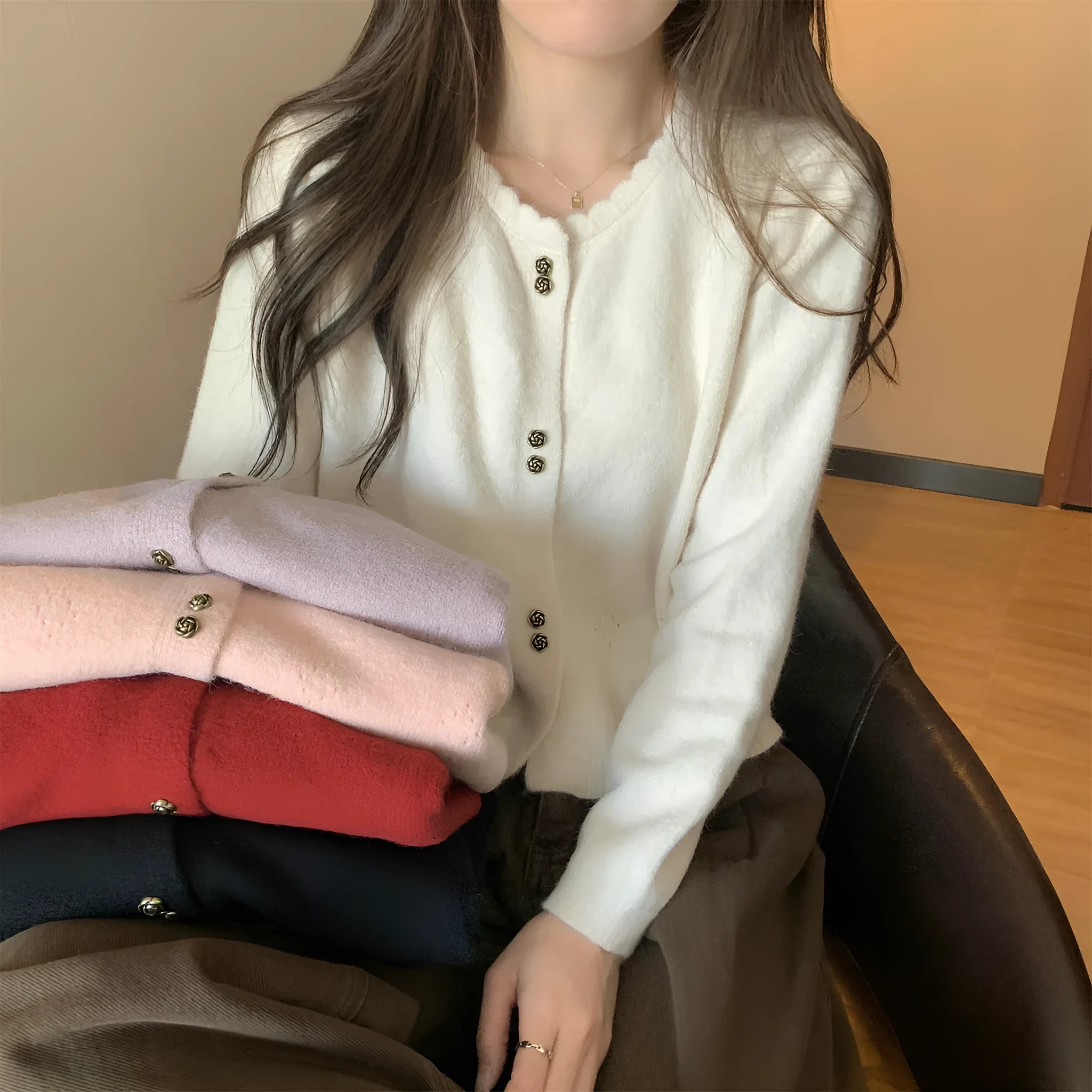 Women's long-sleeved acrylic cardigan coat in light purple, shown with cardigan front open.