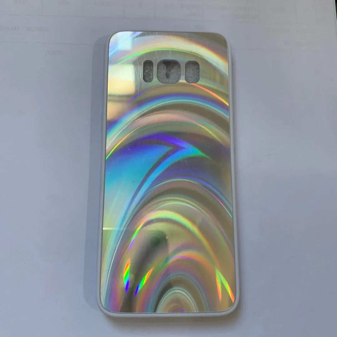 A 3D rainbow glitter gradient back cover case for a smartphone, showing its full-coverage design and sparkling finish.