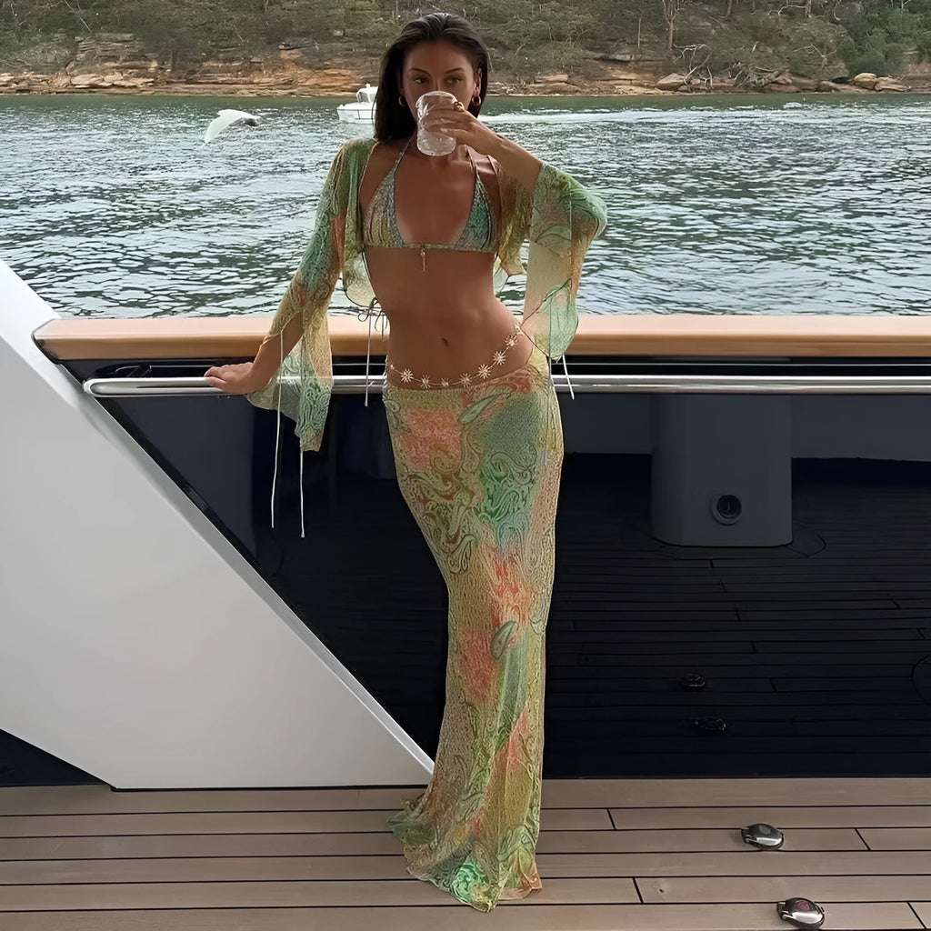 Green halterneck printed lace-up split swimsuit with long bell sleeves on a model