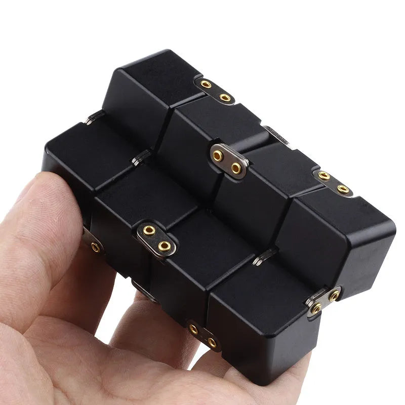 Zinc alloy infinity cube fidget toy showing black and silver colour options, sized at 4cm.