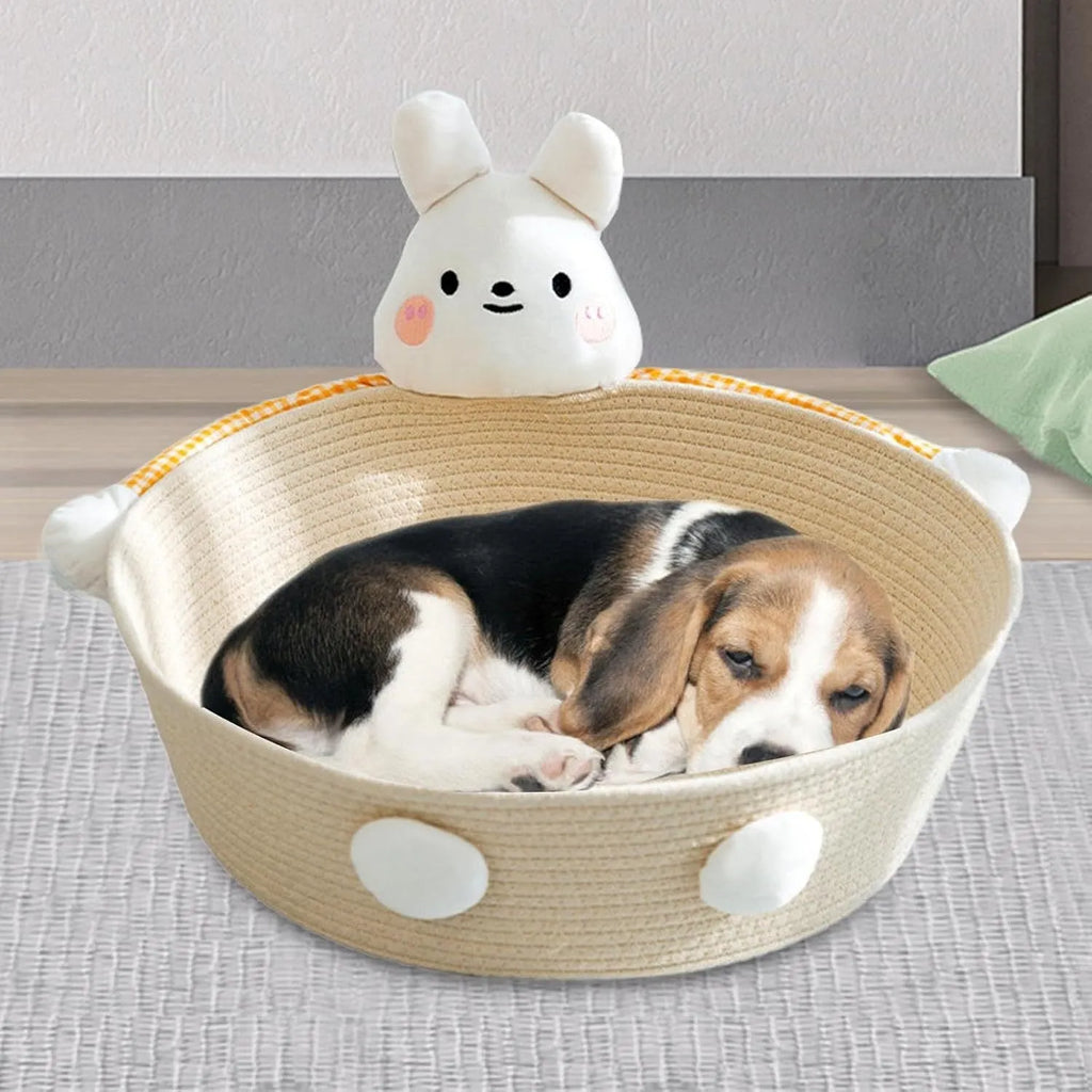 Woven cotton rope cat bed with scratching surface, shown with bear decoration in medium size.