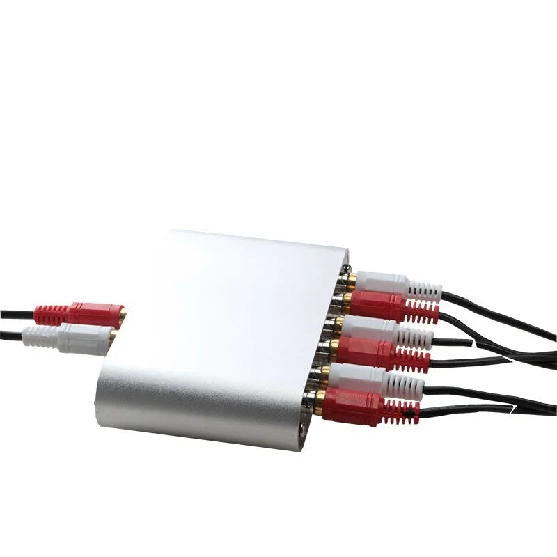 Silver aluminium audio source selector switch unit with front panel button and infrared remote.