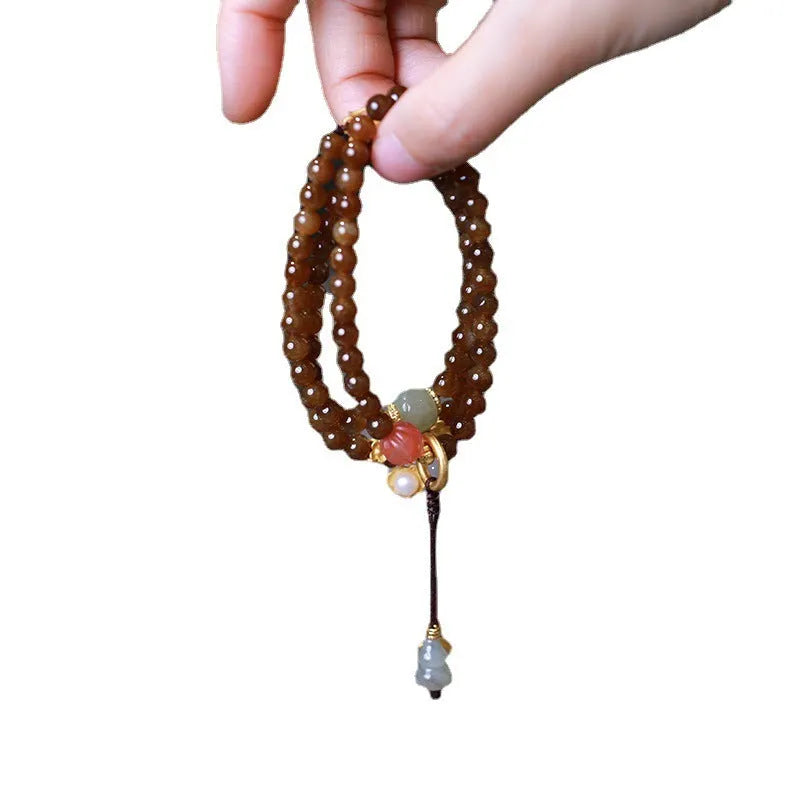 Brown jade Hetian jade three-ring bracelet with butterfly and gourd pearl design