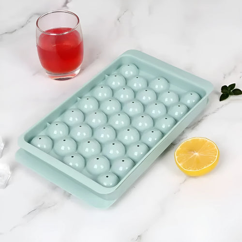 Blue 33-grid round silicone ice cube tray with transparent lid next to pink version, showing dimensions.
