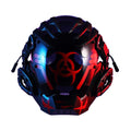 Black full-face polymer helmet with tech design, shown on a stand against a dark background.