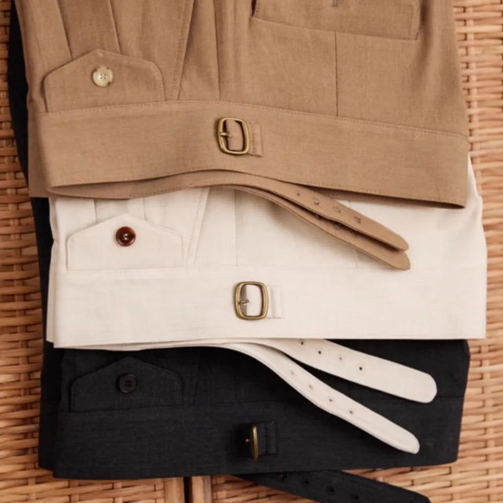 Man wearing slim fit wrinkle resistant business casual trousers in a light brown colour.