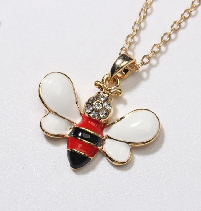 Cartoon bee drop pendant necklace with oil studded alloy finish on cross chain, yellow colour option, on white background