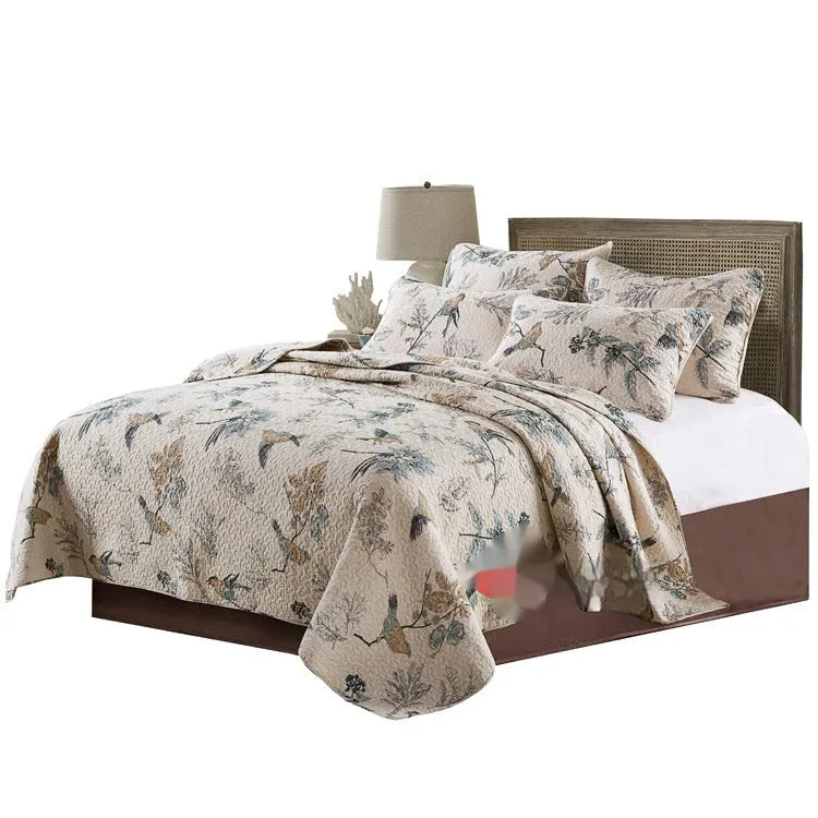 Pure cotton bedspread and pillowcase set in a patterned design on a bed.