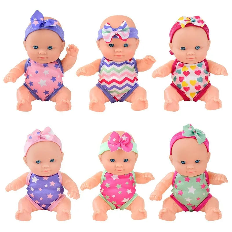 Vinyl baby figurine doll in display with colour variations and measurement scale