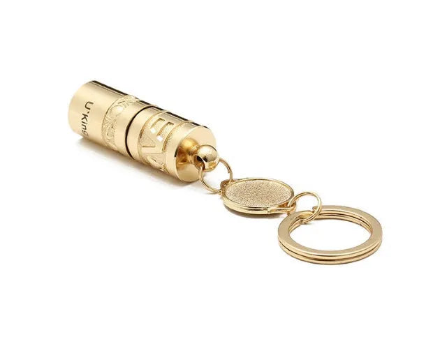 Gold zinc alloy waterproof LED flashlight attached to a keyring.