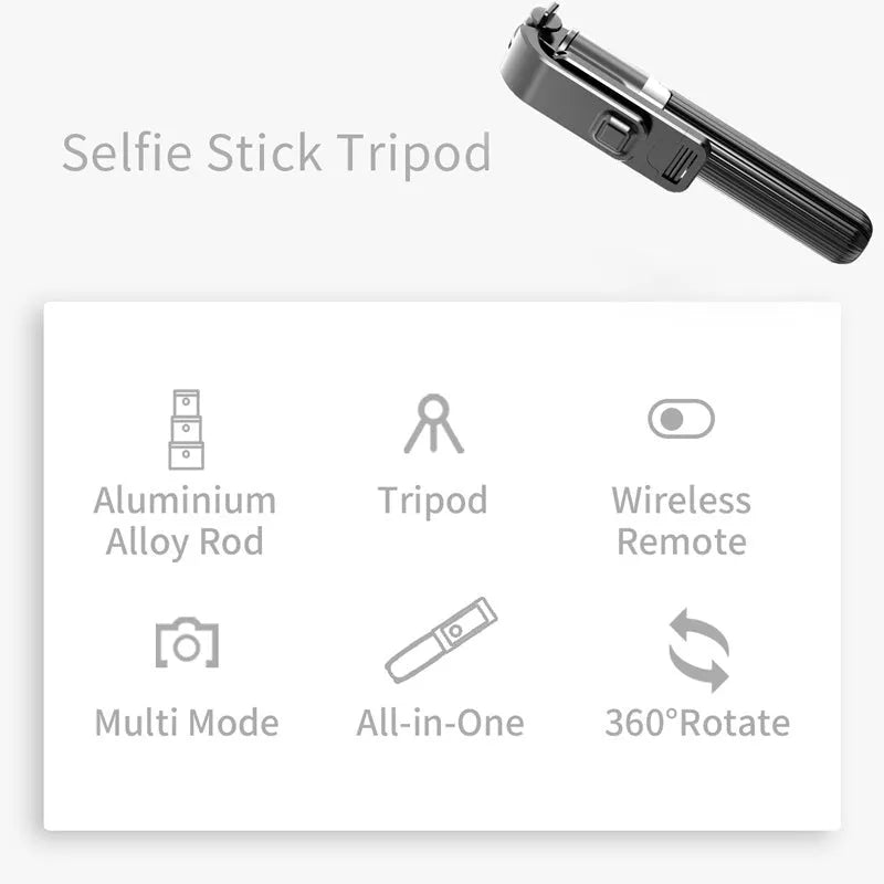 Black aluminium iPhone tripod selfie stick extended to 700mm on a table.