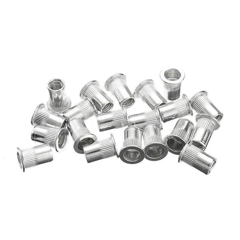 Alloy steel manual riveter nut gun set with nose pieces and mandrels on a workbench.