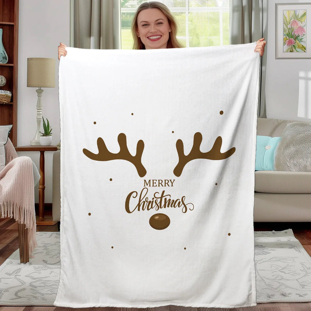 Deer antler pattern Christmas limited edition white flannel velvet blanket on a sofa