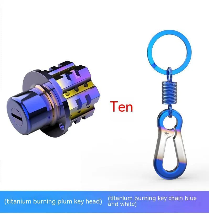 Close-up of a T6 aluminium alloy motorcycle key head cover in a hexagonal design with a blue and white keychain.