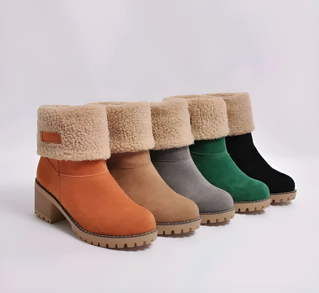 Women's suede mid-tube snow boots in multiple colours with a round toe and low thick heel.