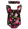 Baby girl in a black cotton romper with small flying sleeves print, showing sleeveless triangle climbing style.