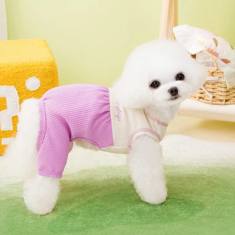 Set of three fashion personalised puppy pyjamas in orange, gray, and purple polyester fabric on white background