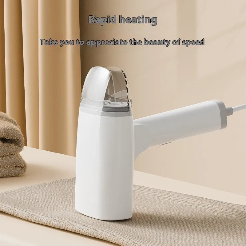 Blue handheld garment steamer with water tank and temperature control buttons