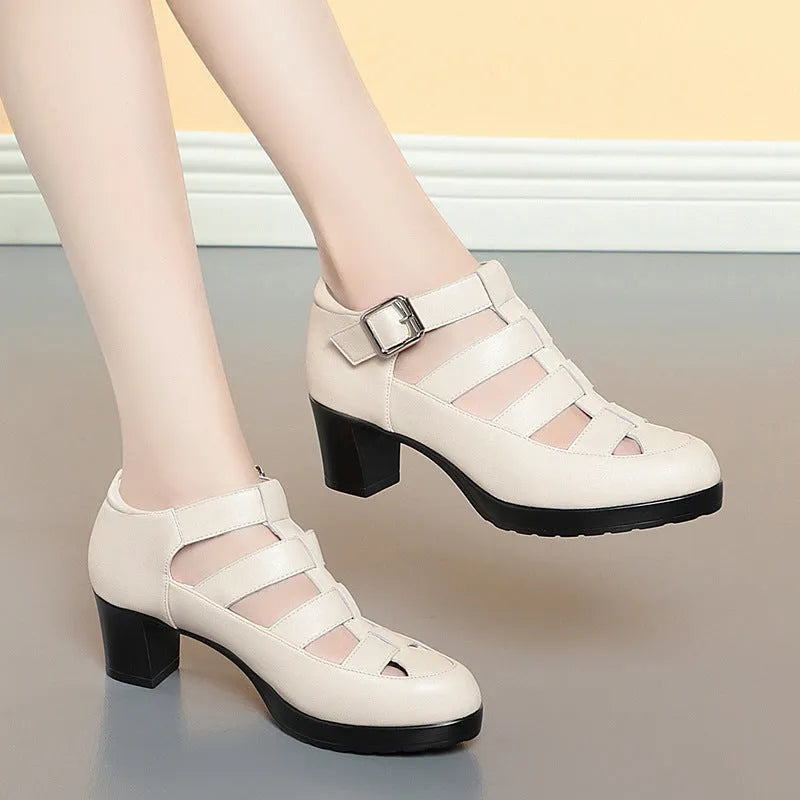 Women's closed toe sandal with chunky heel, woven upper, ankle strap, and back zipper.