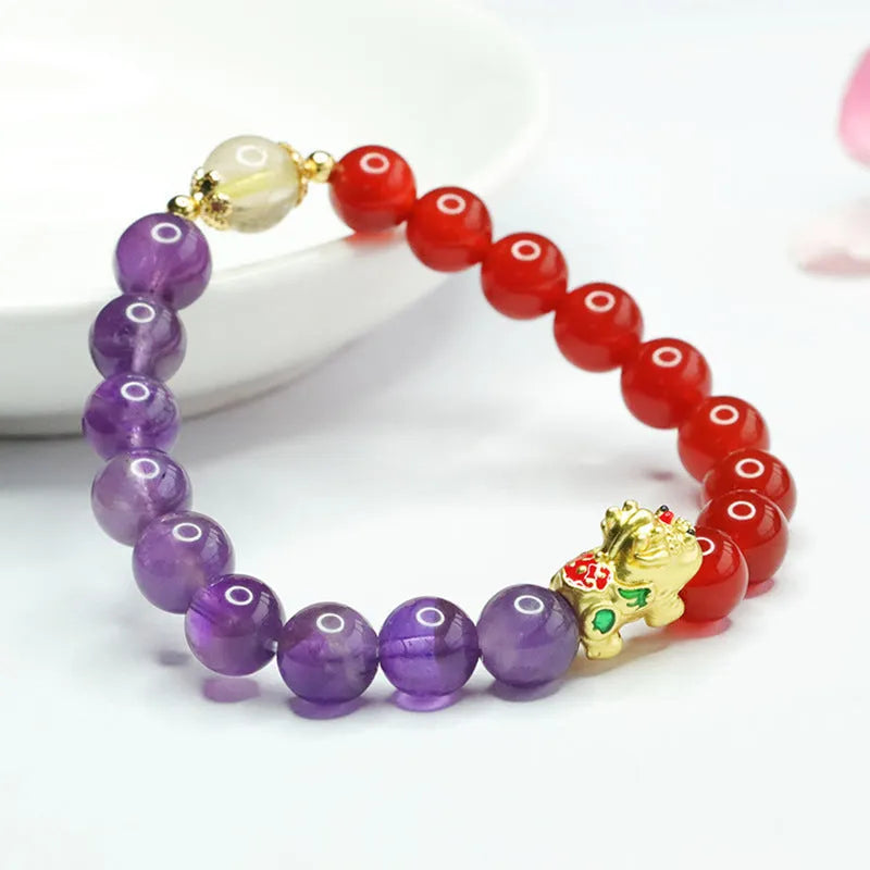 Purple amethyst and red agate beaded bracelet with Chinese style design on wrist