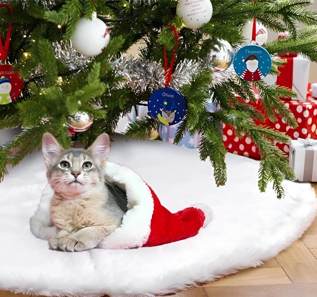 White plush Christmas tree skirt placed around base of decorated Christmas tree, 122cm size