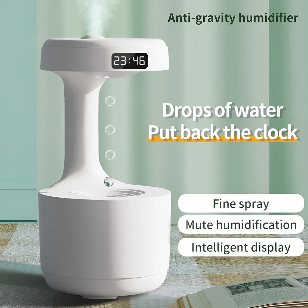 White columnar anti-gravity humidifier on a desk with LED clock display and visible mist.