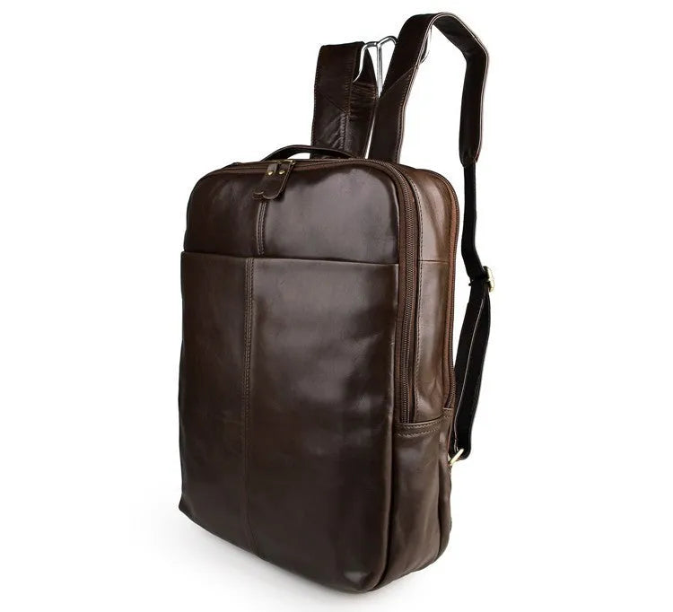 Top layer leather computer backpack in brown colour with zip closure designed to fit a 15 inch laptop