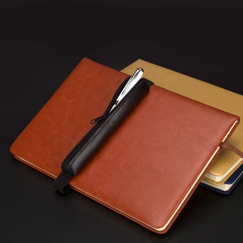 Slim 16.5cm long PU leather office pencil case in beige grey on a desk