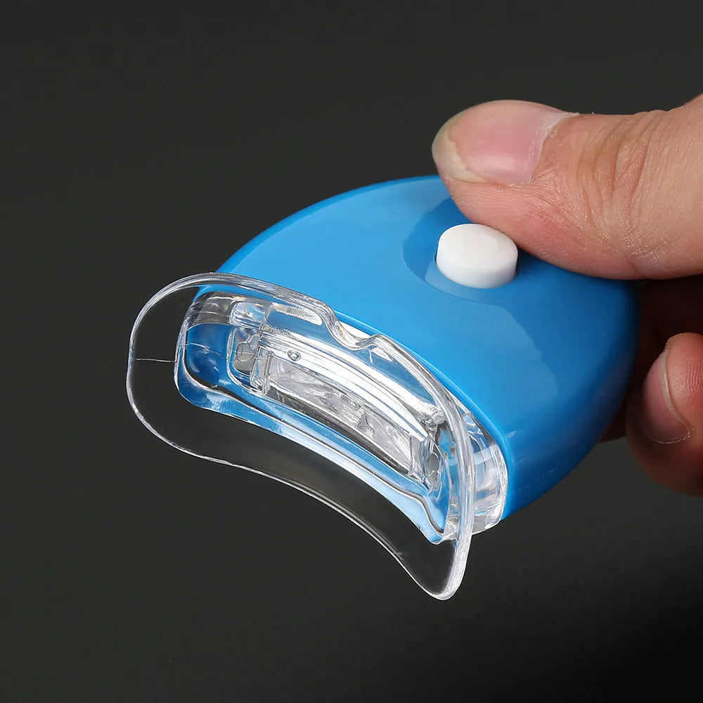 LED teeth whitening kit with wide edge tray and buckle denture system, available in blue, white, or red