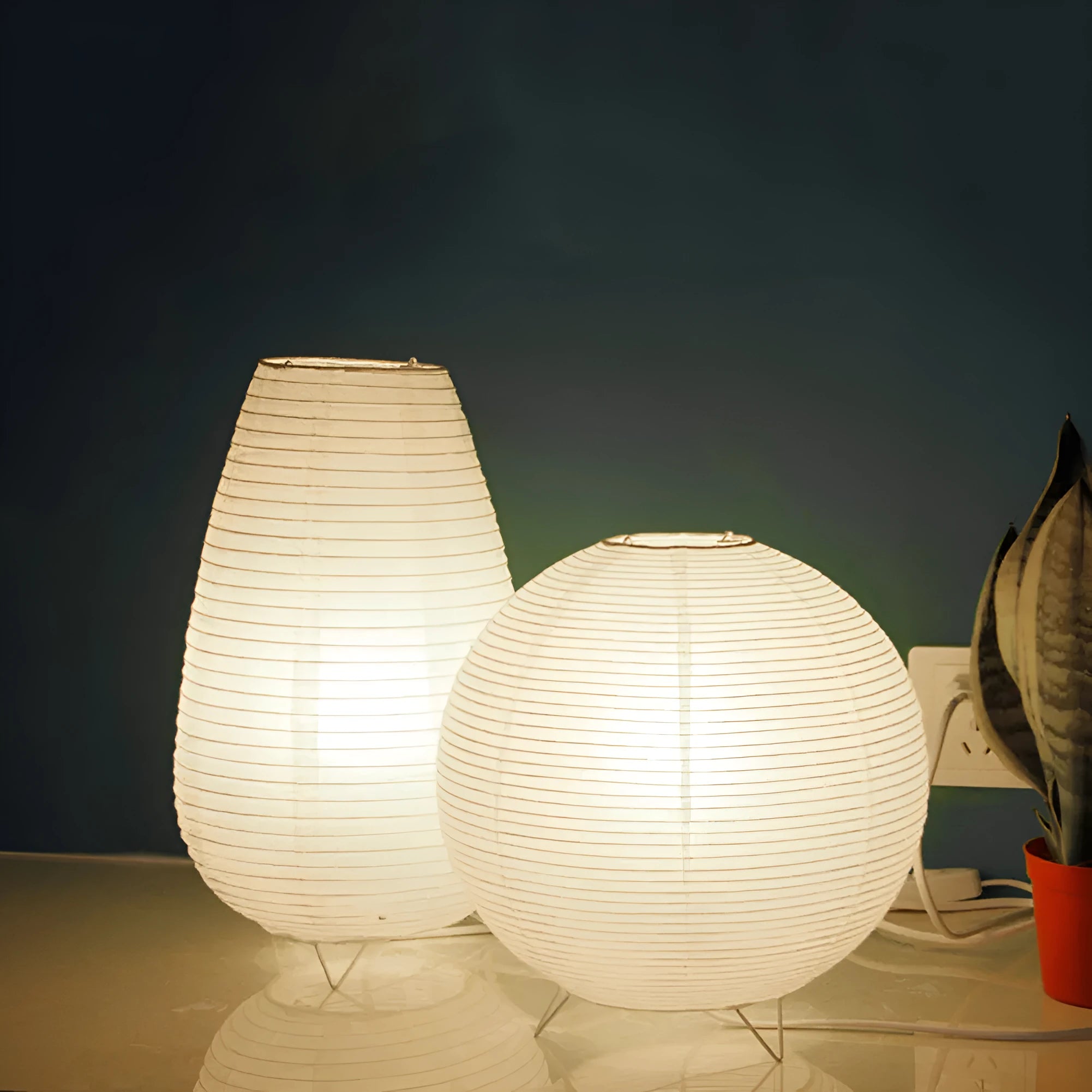 White rice paper plug-in table lamp with E14 bulb socket on wooden desk