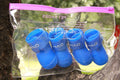 Candy pet rain boots in resin PVC, waterproof non-slip dog shoes, cartoon style, seven colours, sizes S to XXL