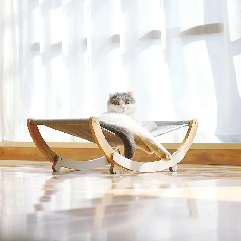 Solid wood cat bed with grey cloth cushion and anti-slip mat base, raised off-ground design