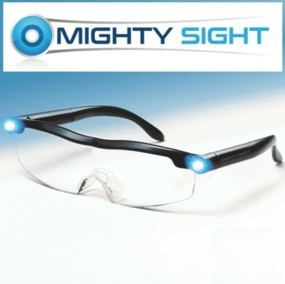 Transparent black USB LED light reading glasses on a table, showing the integrated light and frame.