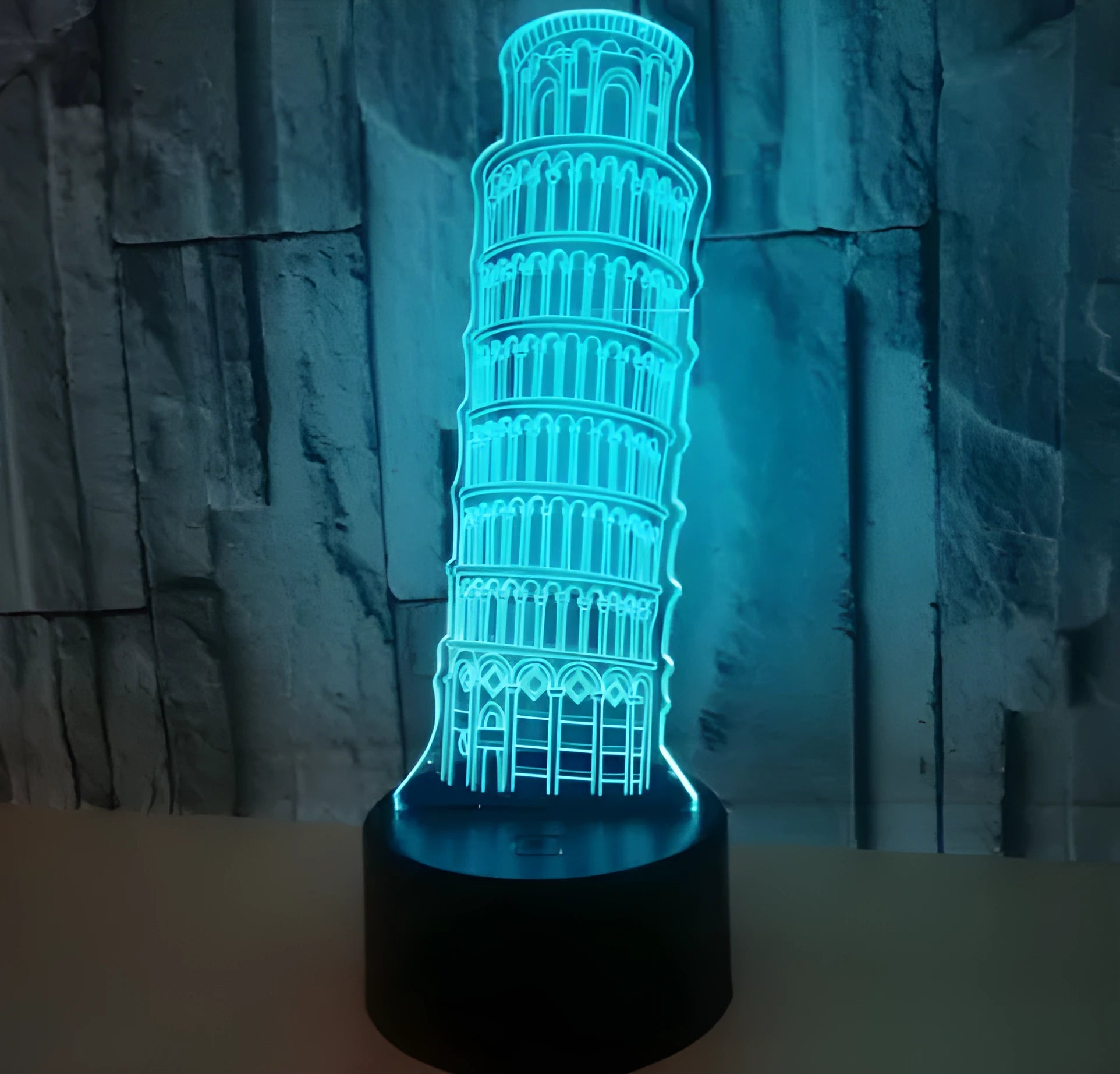 3D Leaning Tower of Pisa LED nightlight with colour-changing lights on a black square base.
