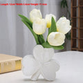 Clover white porcelain ceramic vase in European style on a desk.