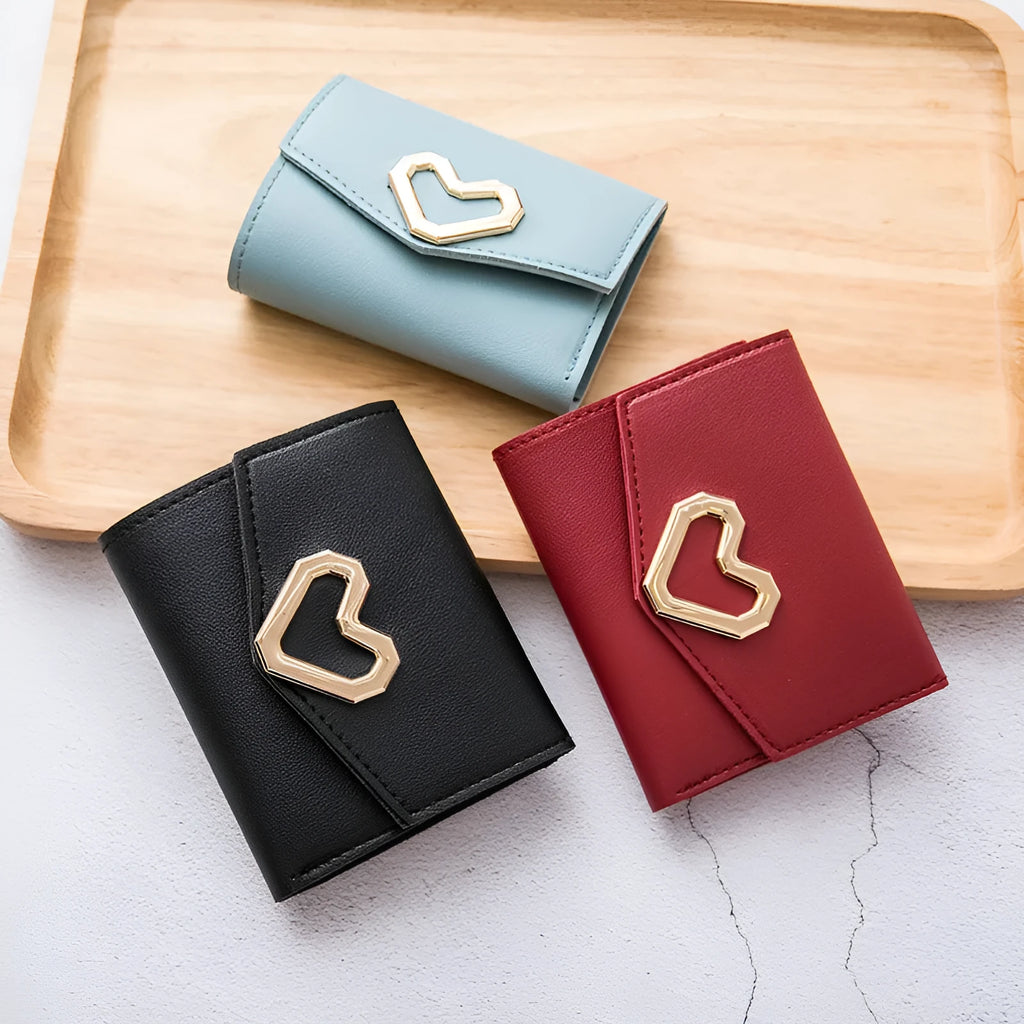Women's PU leather tri-fold wallet with magnetic buckle, card slots, and coin pocket in black