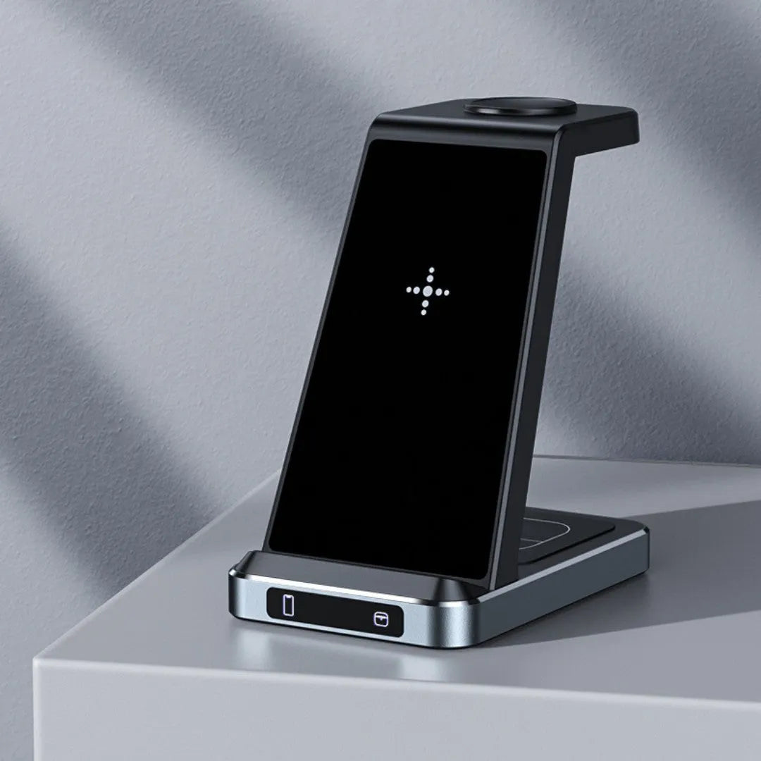 X2 three-in-one wireless charger in black charging a phone, watch, and earbuds on a desk