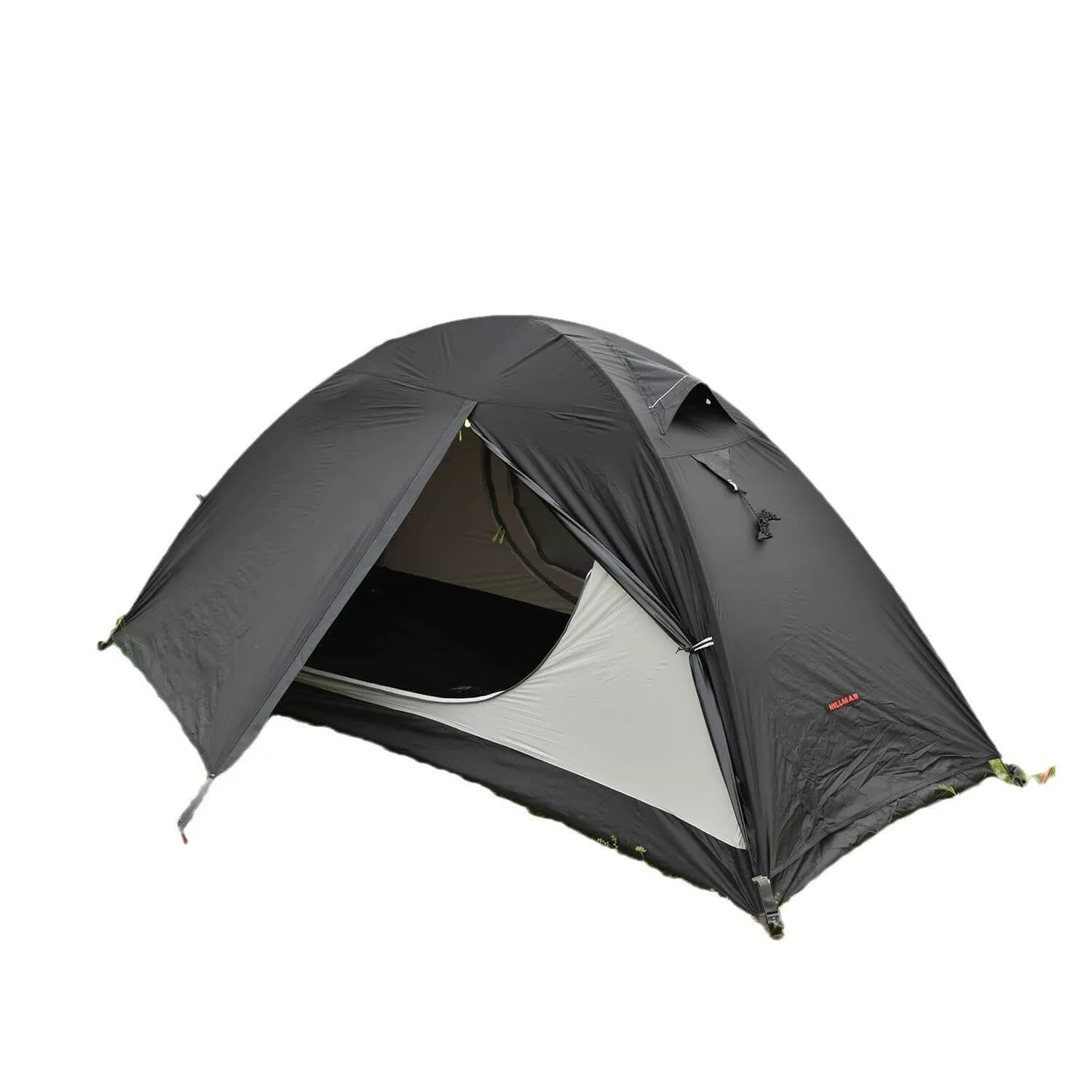 Red single-person backpacking tent with aluminium poles pitched in a forest, showing double-skin design and mesh panel.