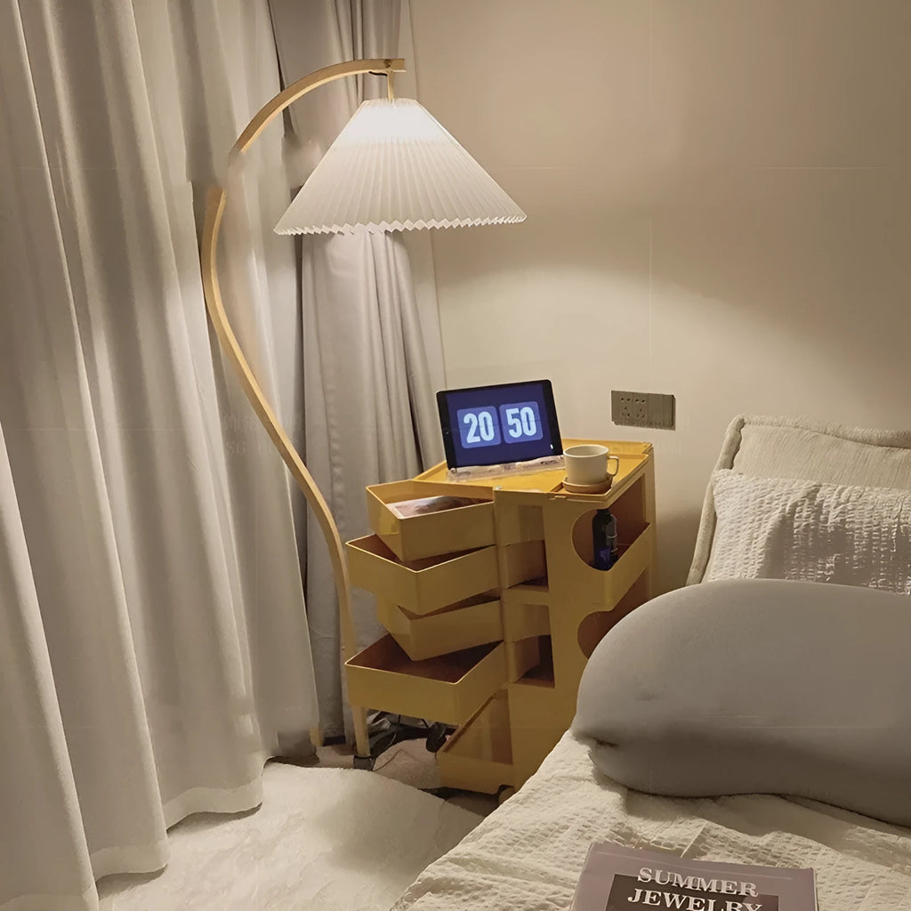 Retro vertical table lamp with a fabric shade in log white, placed on a bedside table.