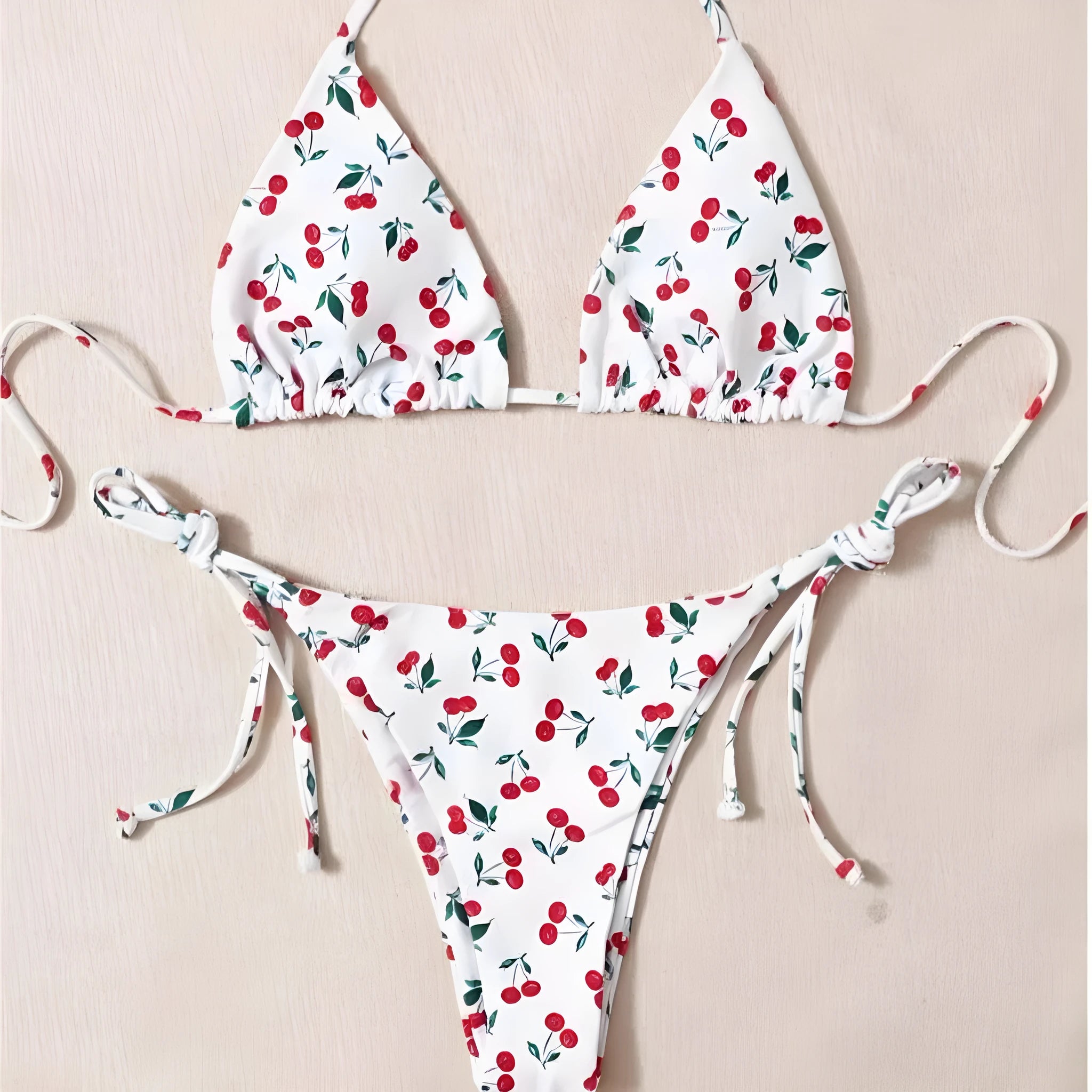 Solid colour split halter bikini top with matching backless briefs on a model