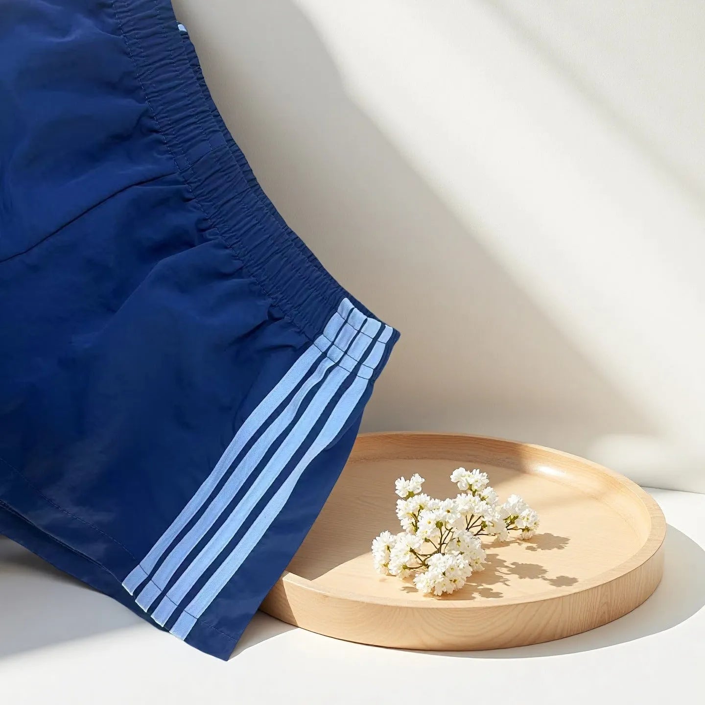 Men's navy blue high waist nylon sports shorts with micro elasticity on a white background
