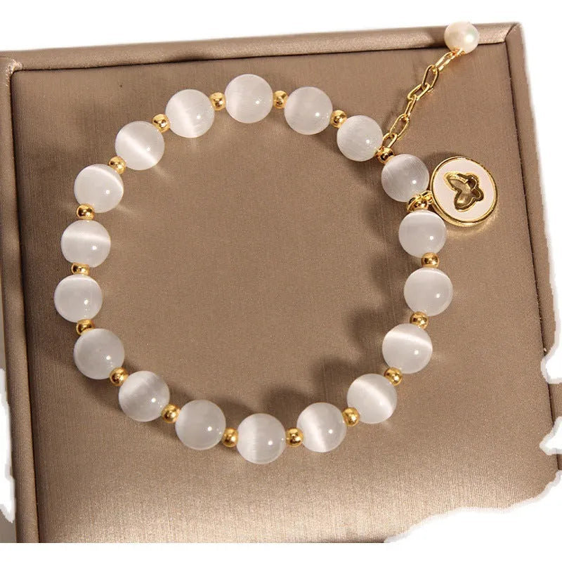 White cat's eye crystal geometric bracelet with adjustable clasp for women.