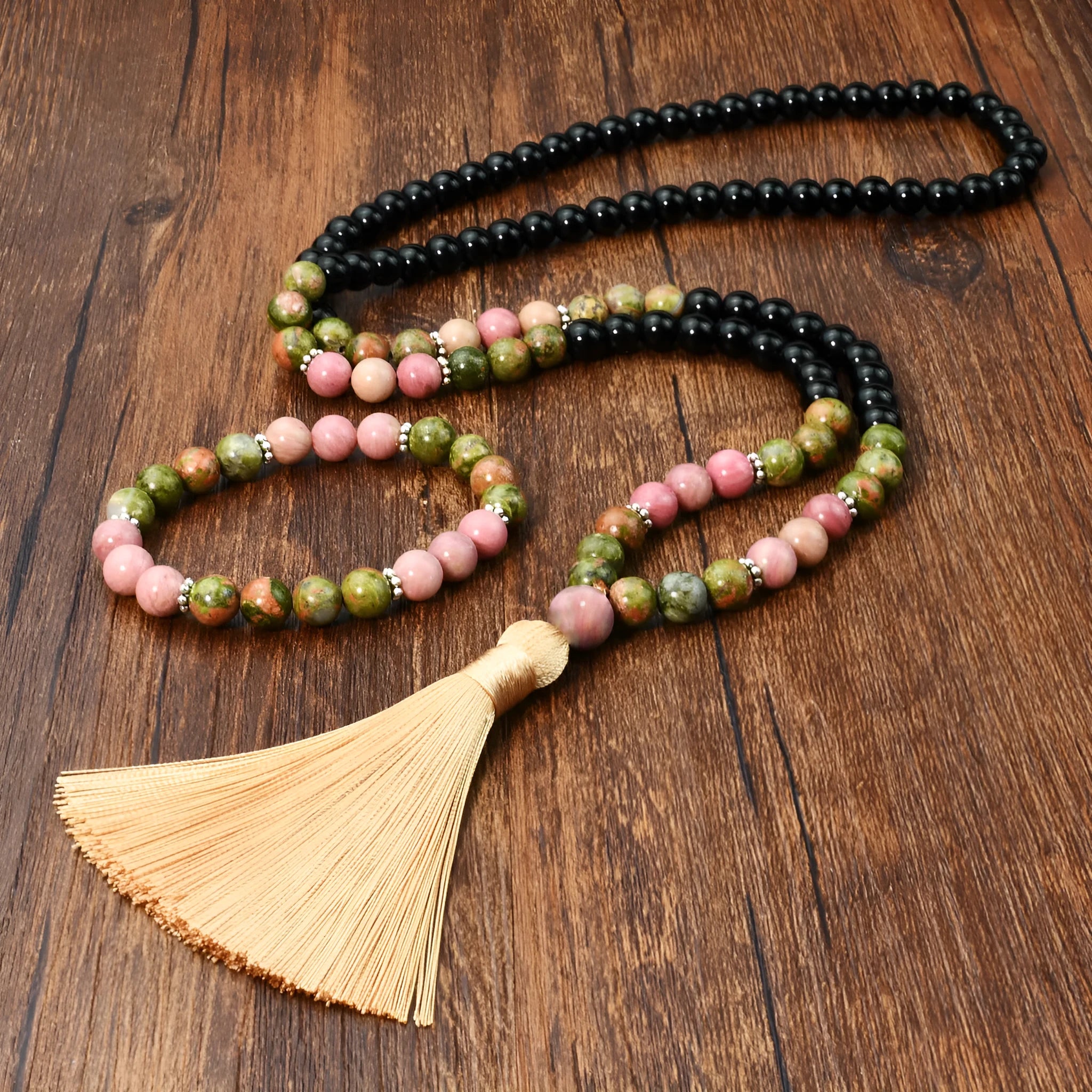 Natural unakite stone 108 prayer beads mala necklace and matching bracelet on neutral background
