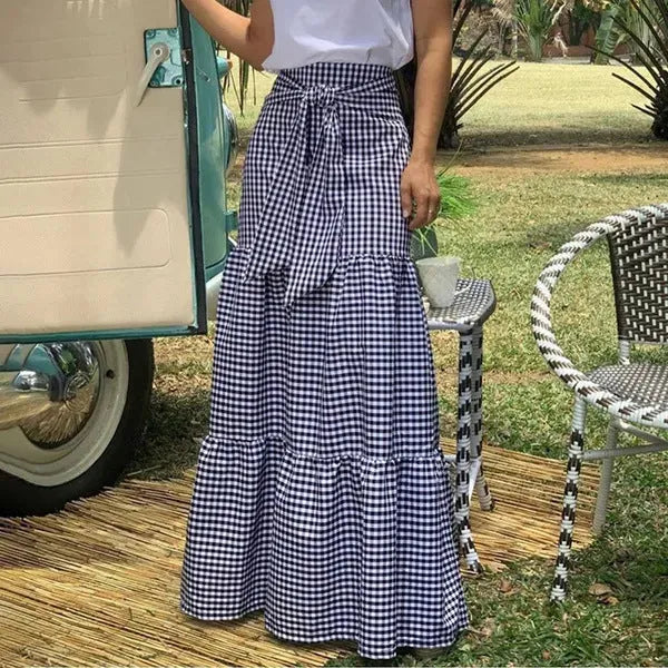 Ruffled hem strappy pleated casual loose skirt in black or blue polyester, sizes S to 3XL.