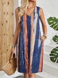 Women's striped sleeveless V-neck dress in a colour block pattern on a mid-length casual vest dress.