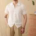 Light brown cotton short sleeve cardigan with zipper front and lapel collar on a hanger.