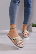 Creamy-white women's platform sandals with a cloth upper, beach bow detail, and a round toe.