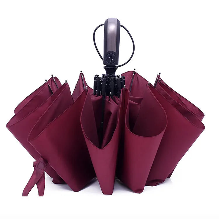 Triple-fold automatic business advertising umbrella in black with steel ribs and a rubber handle.