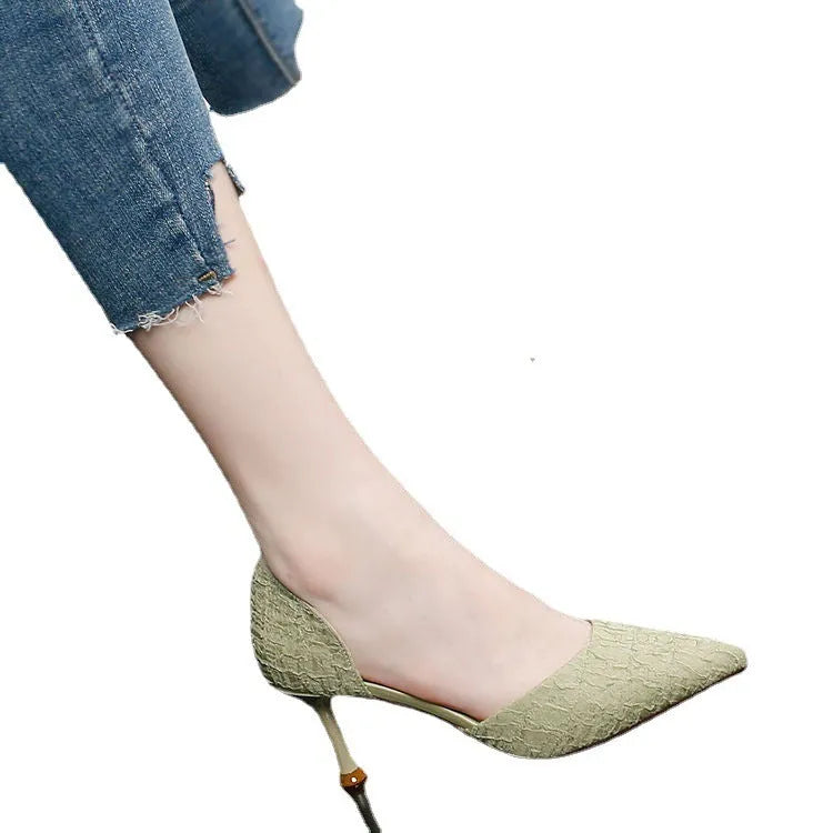 Women's black pointed-toe stiletto high heels with leather stitching details and 6-8cm heel