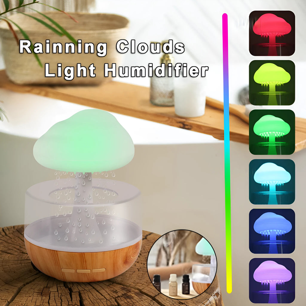 White cloud-shaped humidifier with coloured night light on a table.